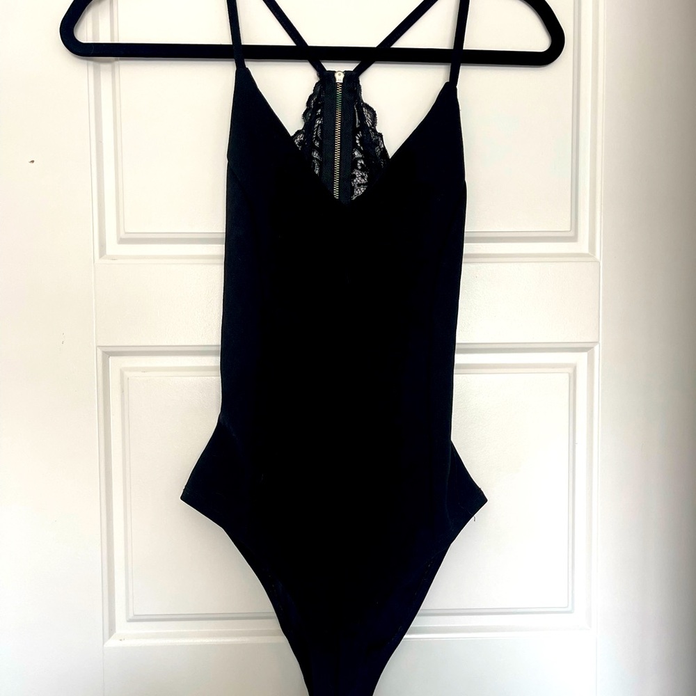 Black bodysuit with lace back detail.